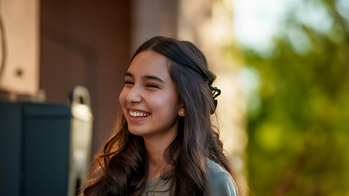 Young student smiling outdoors